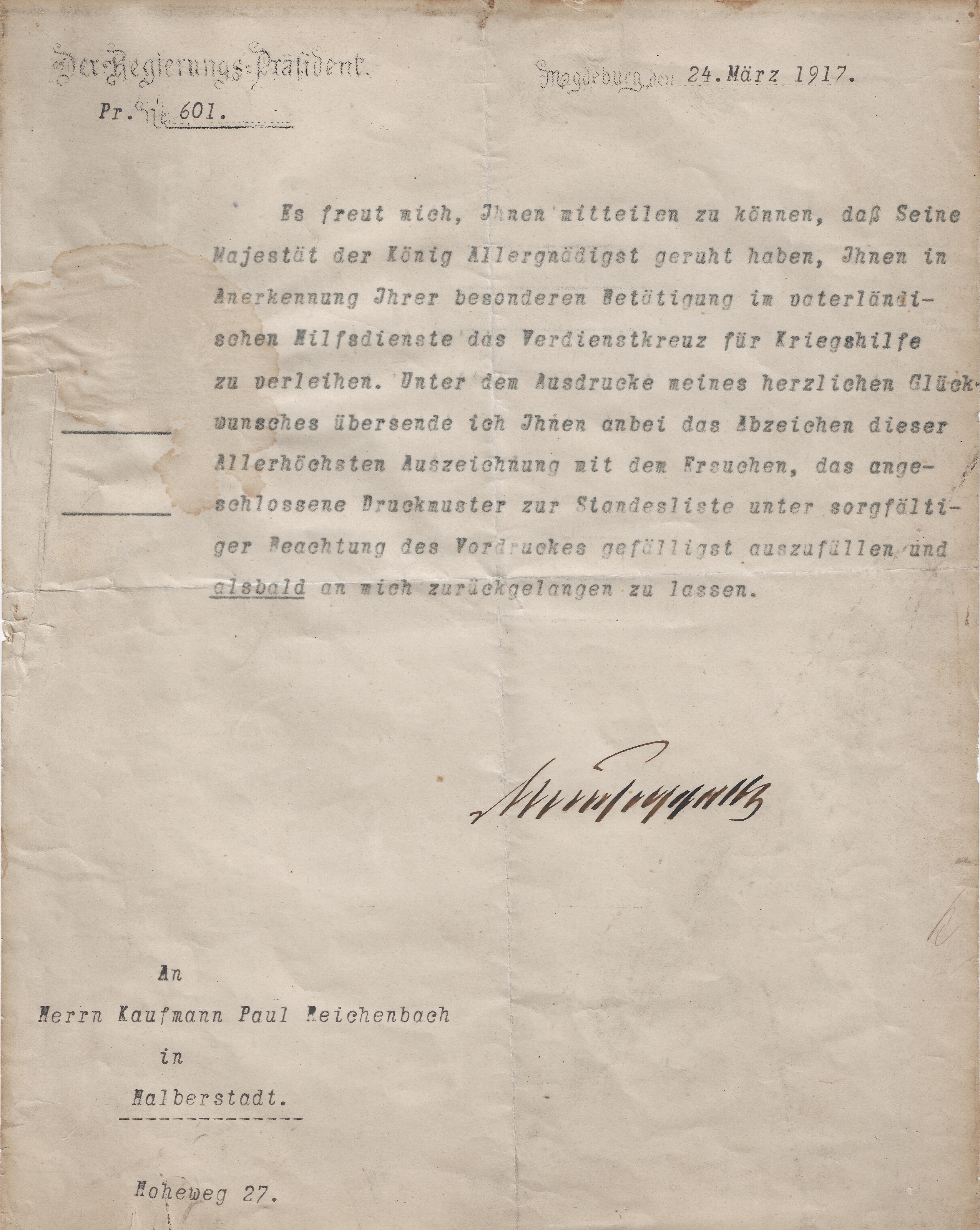 Maschinenschriftliche deutsche Auszeichnungsmitteilung an den Kaufmann Paul Reichenbach am Hoheweg 27